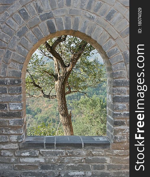 Archway of the Great wall in China with a Tree framed in the archway. Archway of the Great wall in China with a Tree framed in the archway.