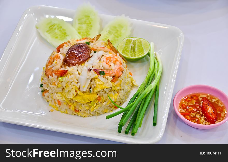 Fried rice with shrimp and vegetable on table