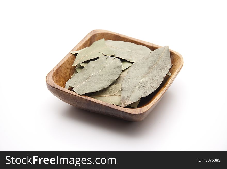 Bay leaves in the wood bowl