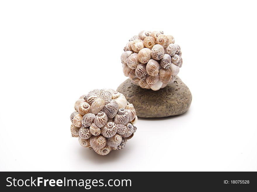 Ball with sea shells on stone