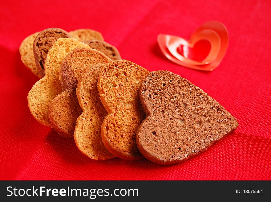 Cookies in heart shape for xmas and Valentine's day on the red napkin