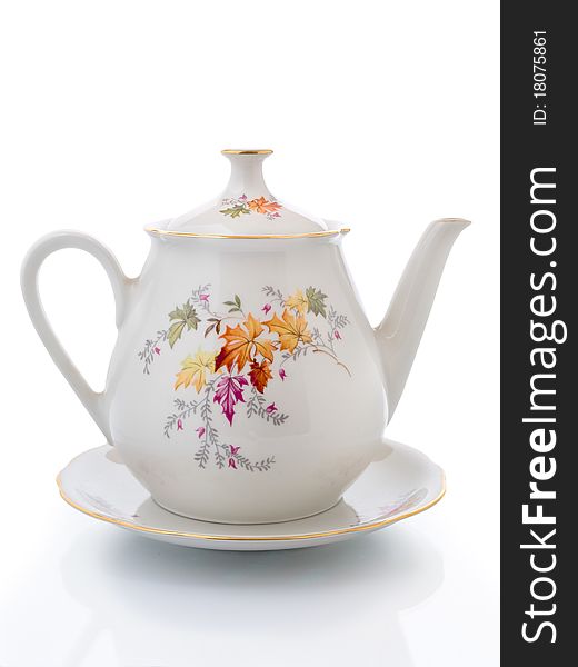Empty White Teapot  On A Saucer Isolated