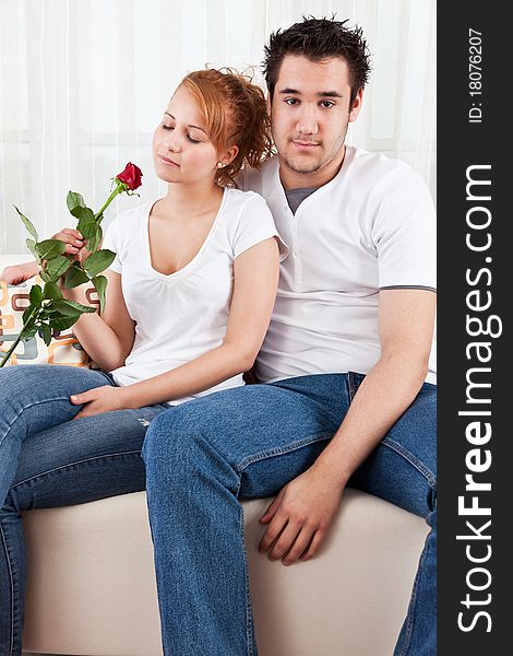 Young Boy And A Beauty Girl With Red Rose