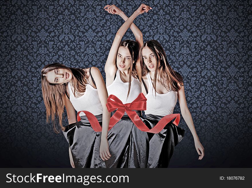 Beauty young womans in gift ribbon