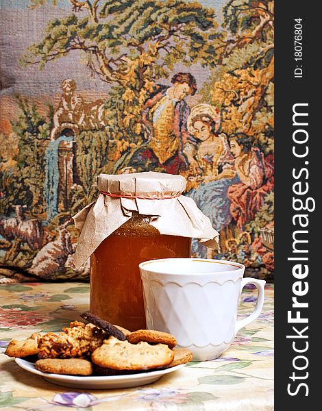 Tea with honey and cookies on flowers pattern