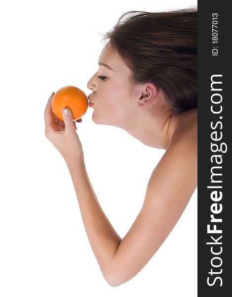 The woman reaches for the orange which holds in his hand, on a white background