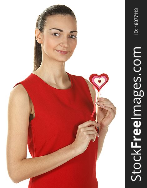 Young elegant female in red pencil-dress holding heart shape isolated on white. Young elegant female in red pencil-dress holding heart shape isolated on white