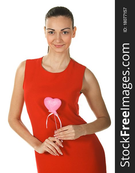 Young elegant female in red dress holding heart shape isolated on white. Young elegant female in red dress holding heart shape isolated on white