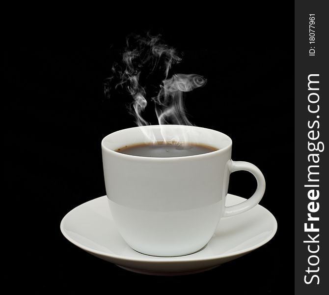 White cup with white smoke isolated on black background. White cup with white smoke isolated on black background