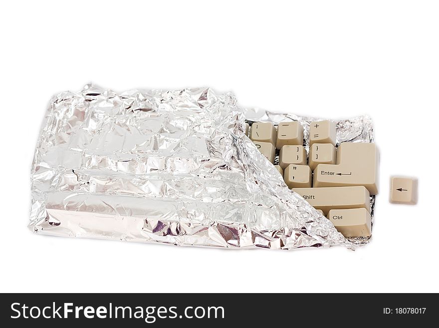 The keyboard in the form of chocolate in foil isolated on a white background. The keyboard in the form of chocolate in foil isolated on a white background