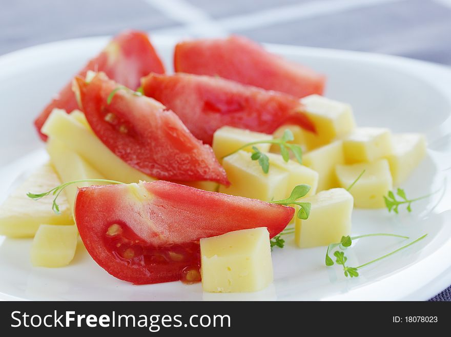 Salad from the cheese and the tomatoes