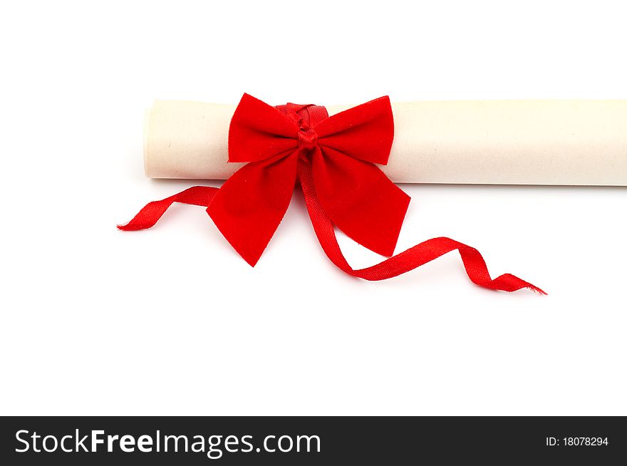 Diploma with red ribbon on white background