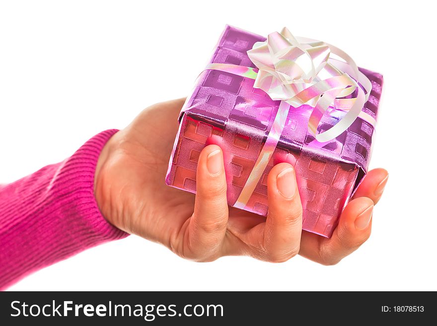 Hand holding pink gift on the white backround. Hand holding pink gift on the white backround.