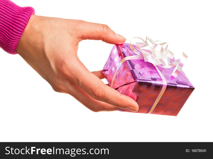 Hand holding pink gift on the white backround. Hand holding pink gift on the white backround.