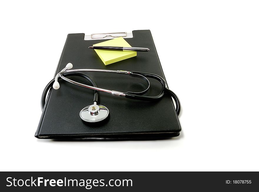 The pure clipboard with a modern stethoscope is isolated on a white background