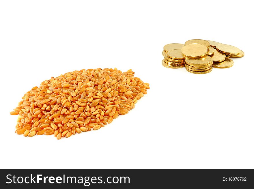 Grain of wheat and metal coins are isolated on a white background