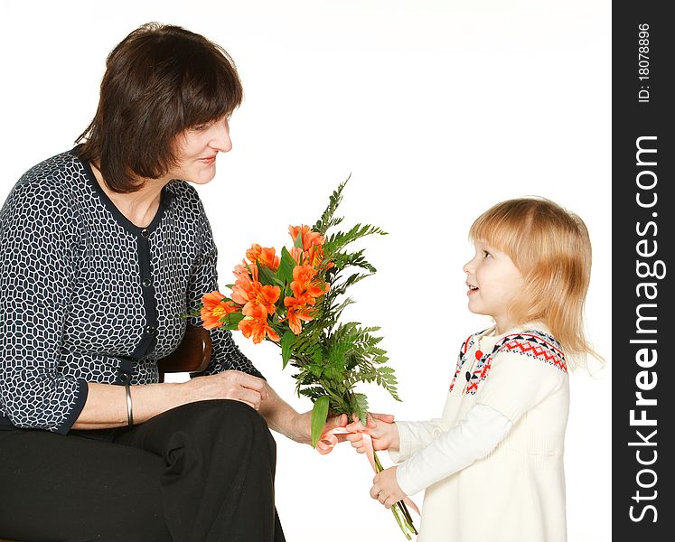 Granddaughter Presenting Bunch Of Flowers