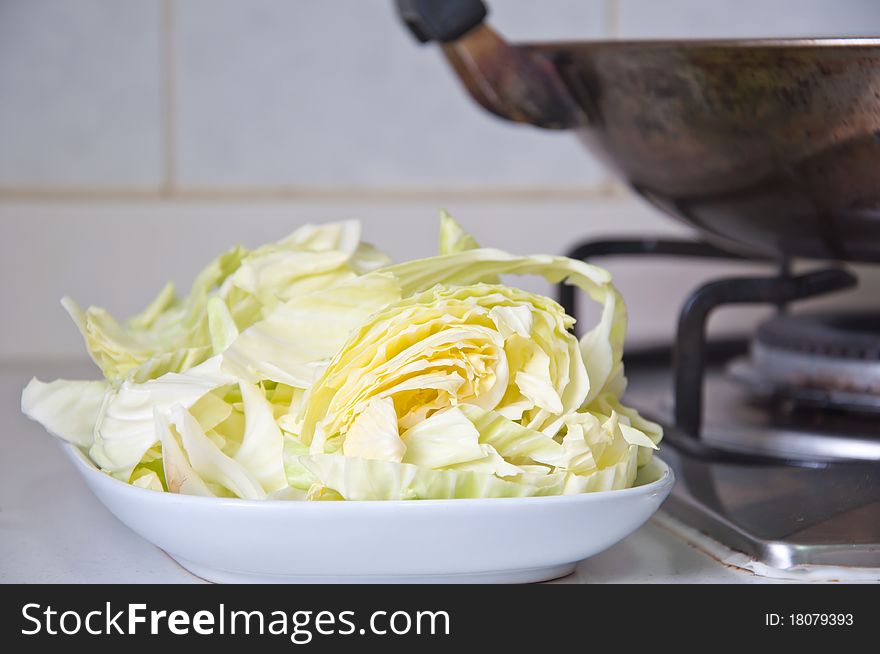 Cabbage shredded on plate waiting for cooking. Cabbage shredded on plate waiting for cooking