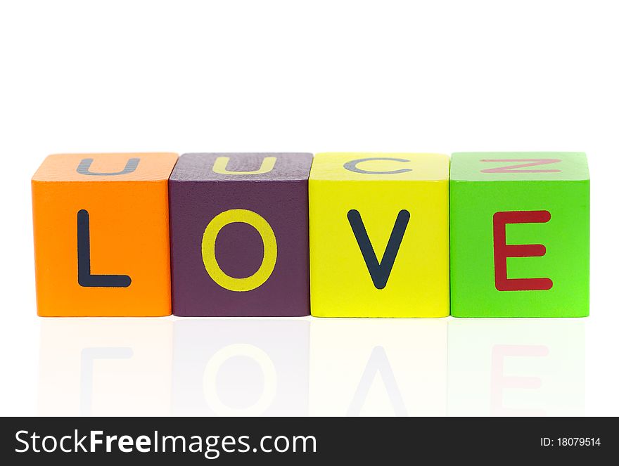 Love  - word formed with alphabet blocks isolated on a white background