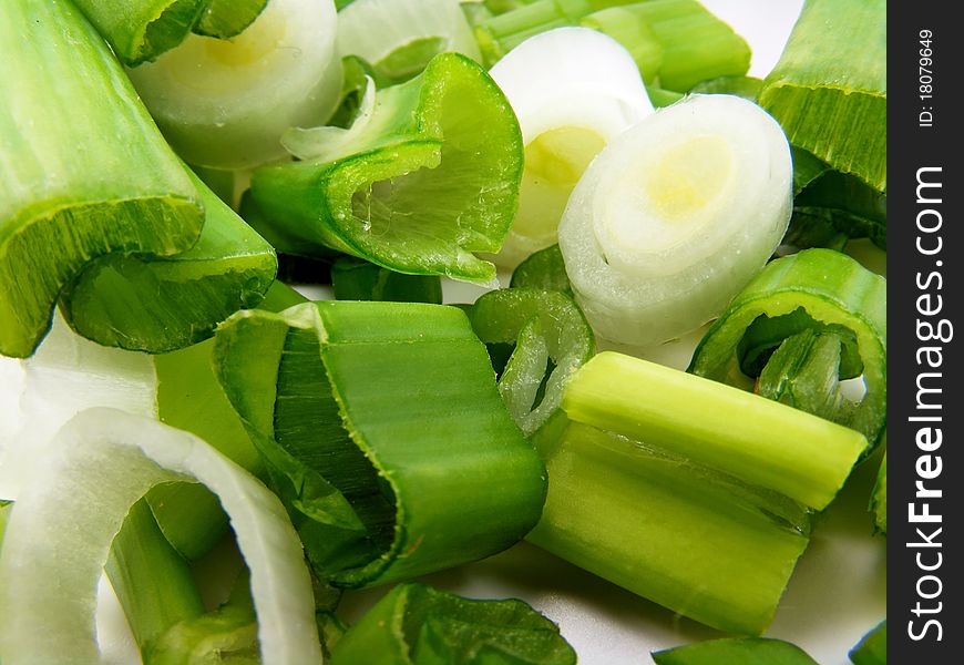 A macro close up image of spring onion slices