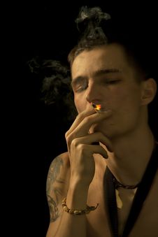 Smoking Young Man Closed Eyes Royalty Free Stock Photography