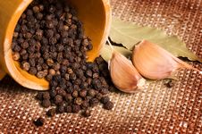 Black Peppercorns With Garlic And A Bay Leaf Stock Images Black Peppercorns With Garlic And A Bay Leaf Stock Images