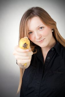Image Of Girl Holds Banana As A Gun Royalty Free Stock Images