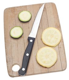 Sliced Yellow Squash On A Wooden Chopping Block Royalty Free Stock Images