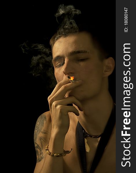 Smoking young man closed eyes