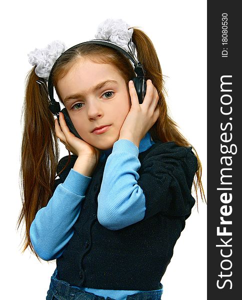 Girl in headsets listening music isolated on white background