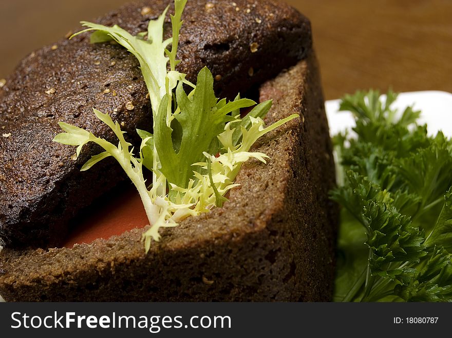 Red soup in a loaf of brown bread