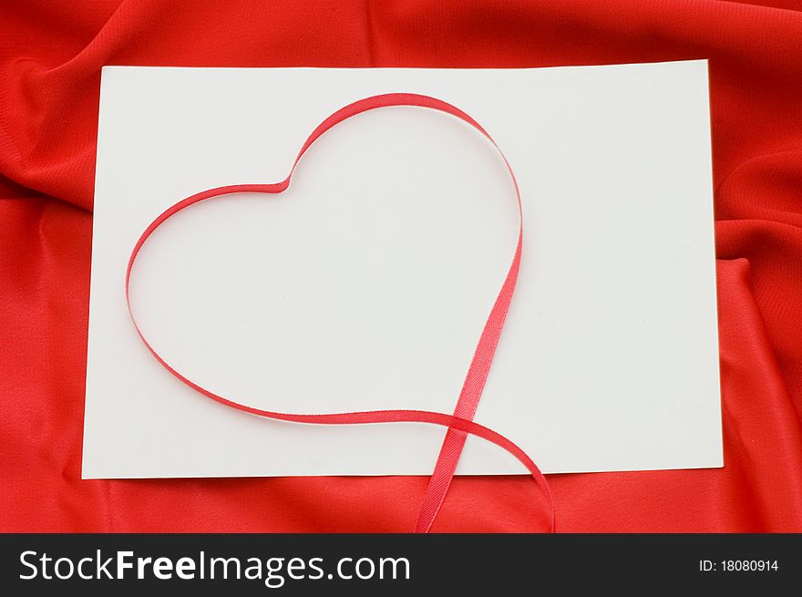 Pure sheet papers on a red fabric background