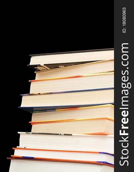 Pile of old books On a black background