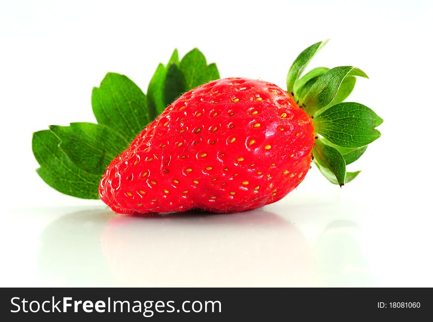 A fresh strawberry isolated on white background. A fresh strawberry isolated on white background.