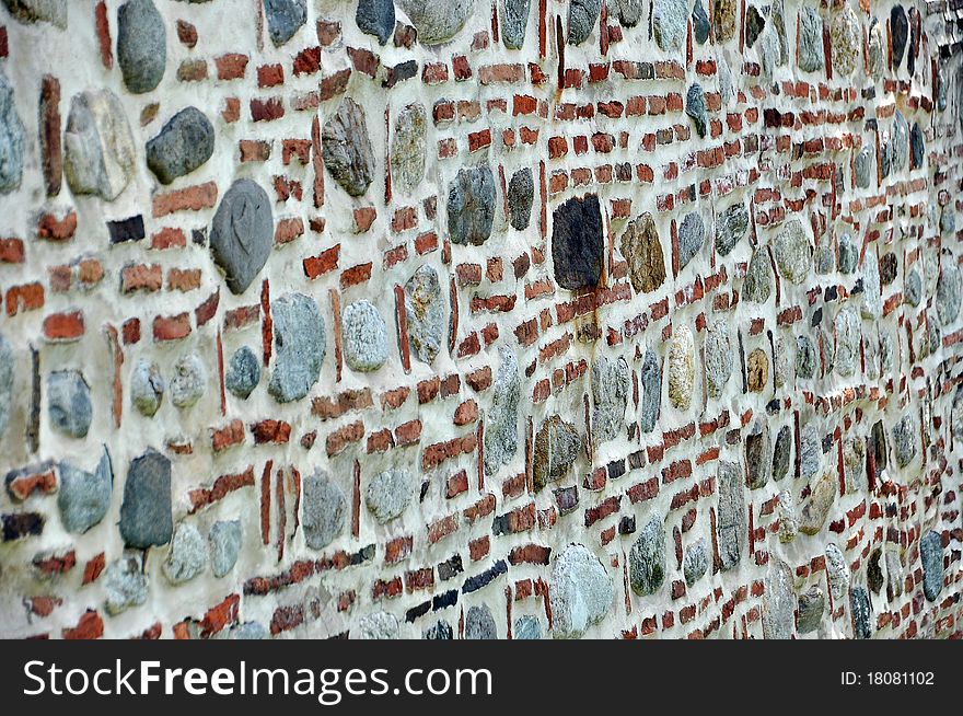 Old wall made out of bricks and stones. Old wall made out of bricks and stones