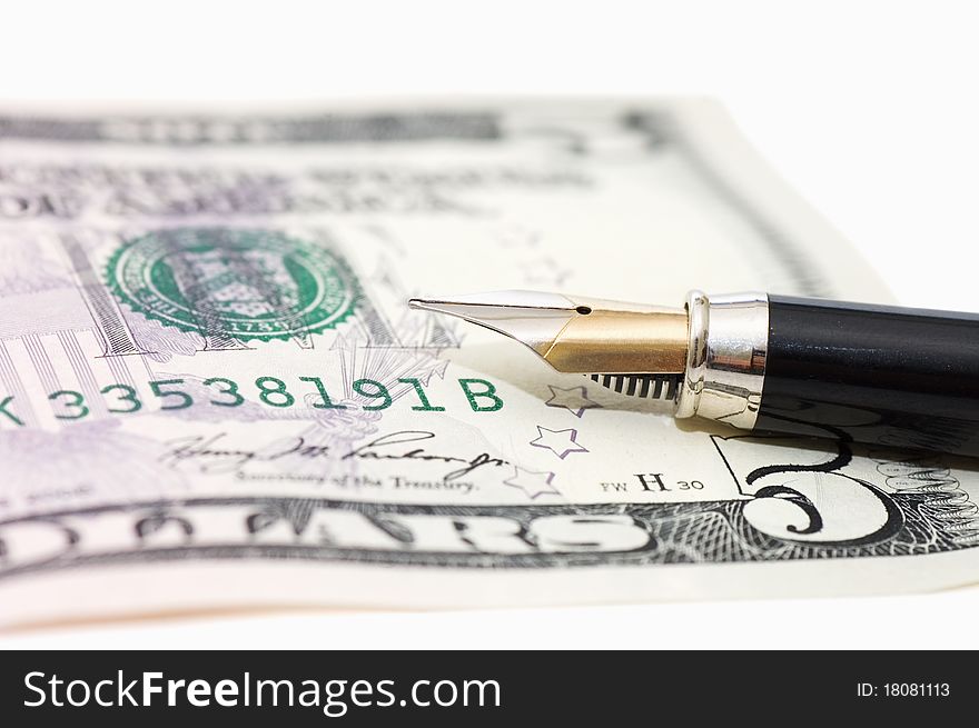 Dollar banknotes and pen