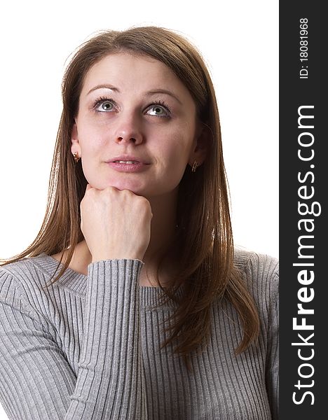 Young thinking woman in grey sweater isolated over white background