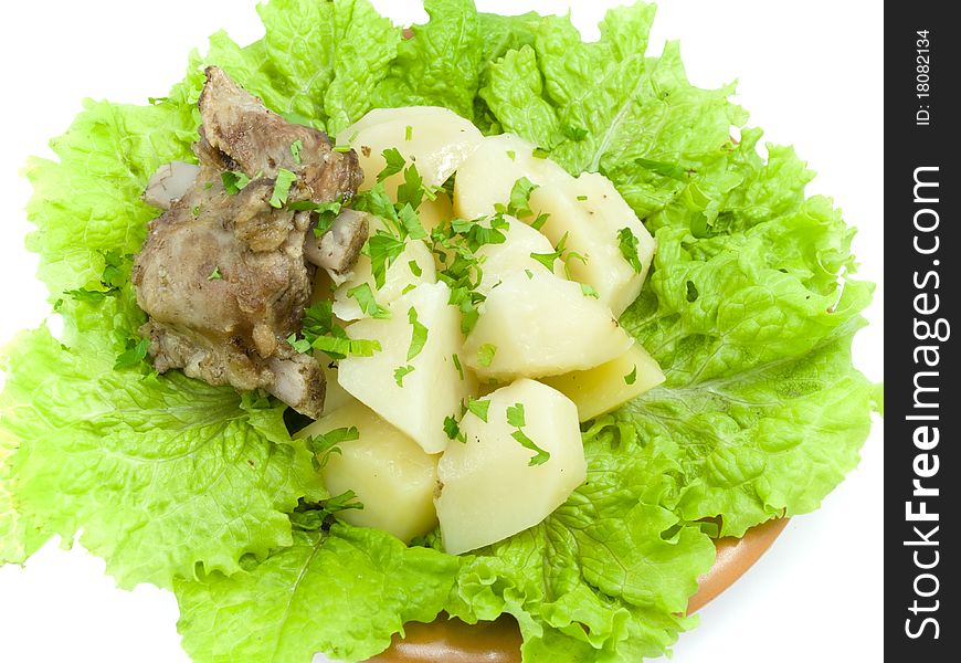 Boiled potatoes is found on brown plate, which is located on white background. Boiled potatoes is found on brown plate, which is located on white background