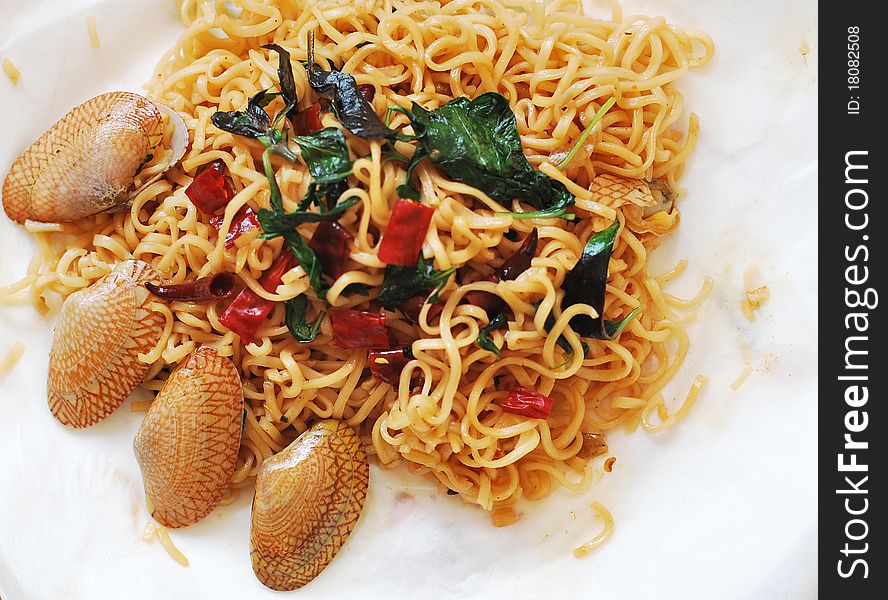 Noodle fried stripes shellfish (thai food)
