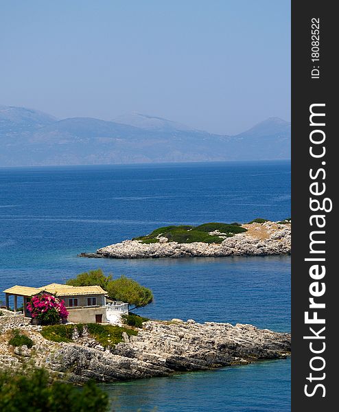 View Of Greek Island With House And Blue Sea