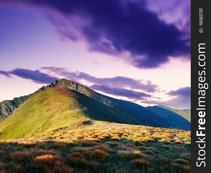 Mountain landscape with the cloudy sky