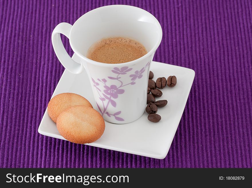 An elegant cup of coffee with biscuits. An elegant cup of coffee with biscuits