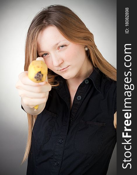 Image Of Girl Holds Banana As A Gun