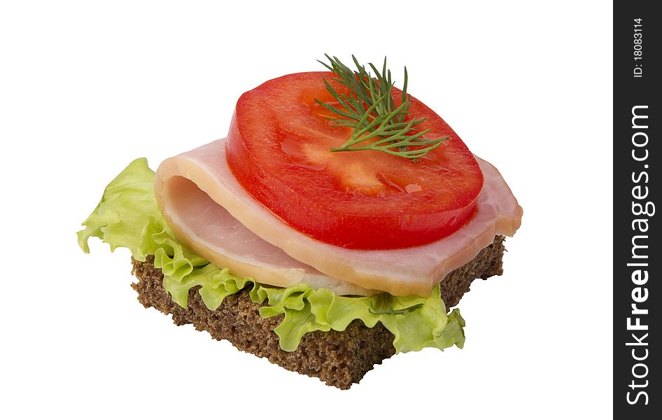 Danish open sandwich with tomato, ham and salad on a dark rye bread. Isolated on a white background.