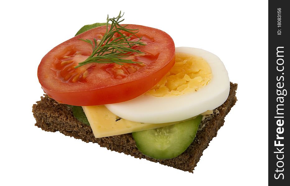 Danish open sandwich with tomato, cheese, egg and cucumber, on a dark rye bread. Isolated on a white background.