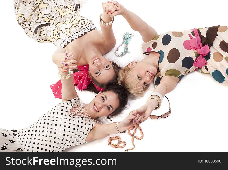 Girls in classic colorful dresses posing to the camera. Girls in classic colorful dresses posing to the camera