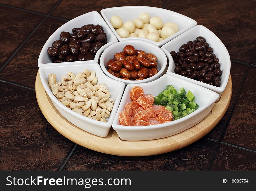 Dried fruit and nuts in chocolate in the bowl prepared for party