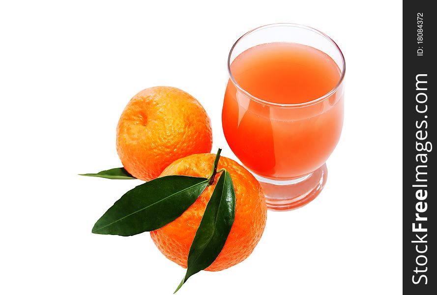 Glass of juice and two mandarins isolated on a white background