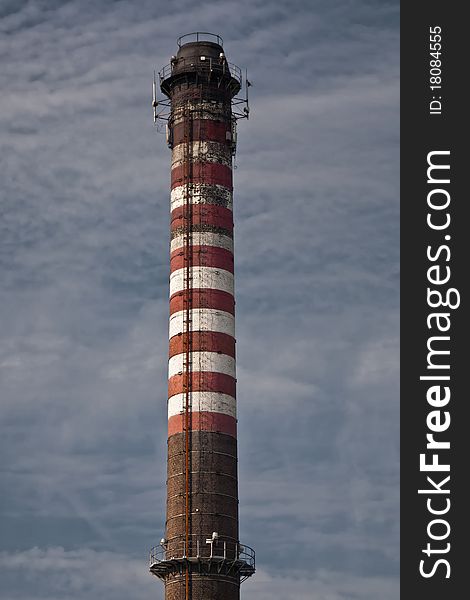 Industrial chimney with red and white stripes