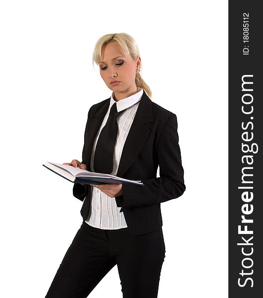 Blonde in a business suit reads diary. Blonde in a business suit reads diary.